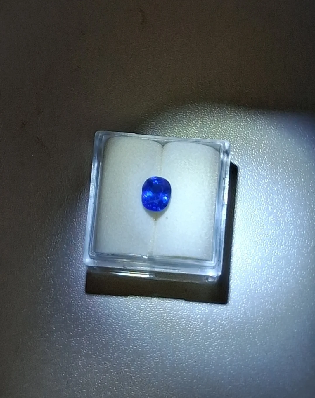 Oval Sri Lankan blue sapphire in a display box