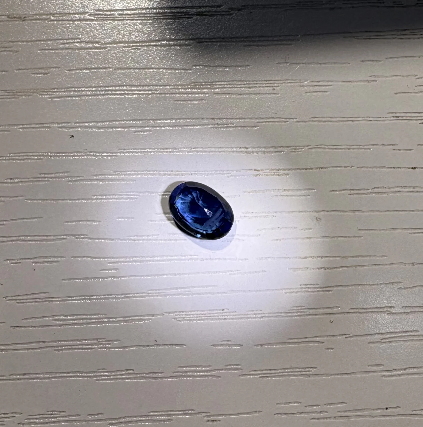 Close view of serial 103 oval blue sapphire