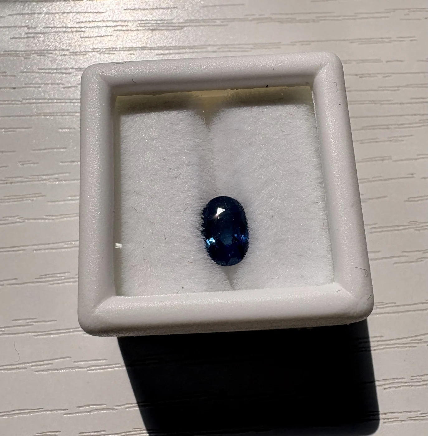 Serial 103 oval blue sapphire in a display box