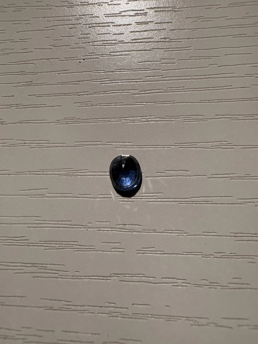 Close view of serial 104 oval blue sapphire