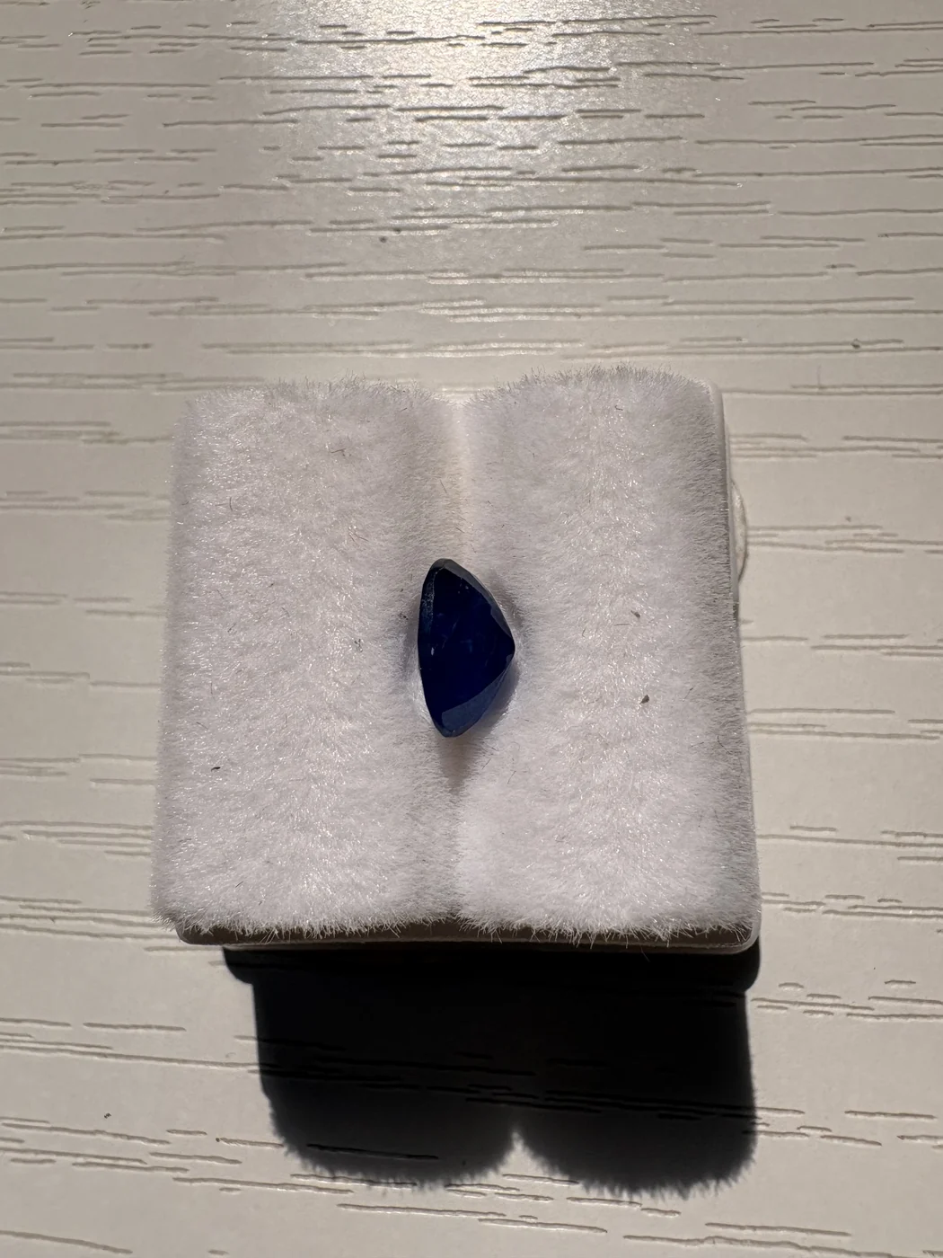 Serial 106 oval Sri Lankan blue sapphire in a display box