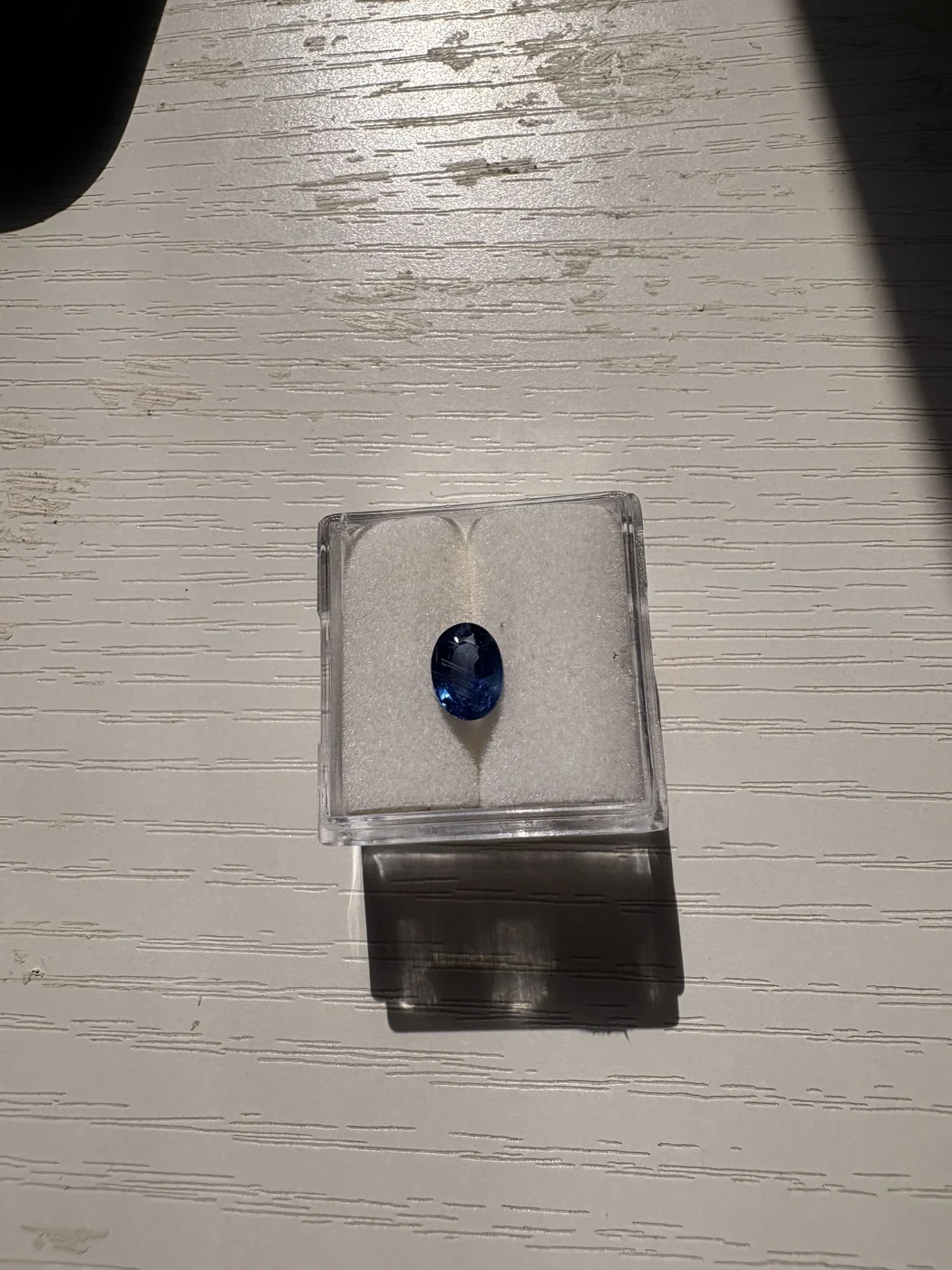 Serial 107 oval blue sapphire in a display box