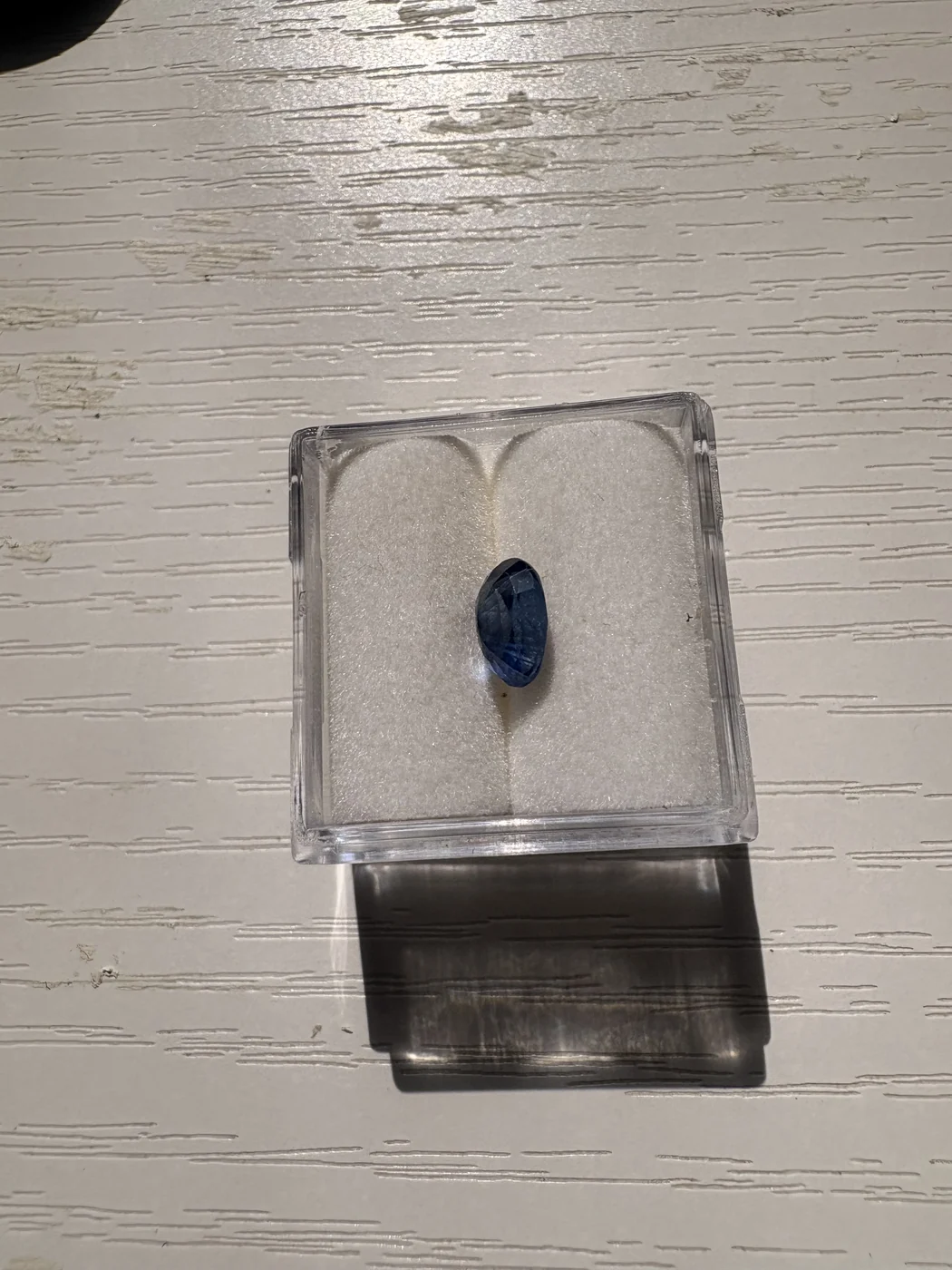 Side view of serial 107 oval blue sapphire