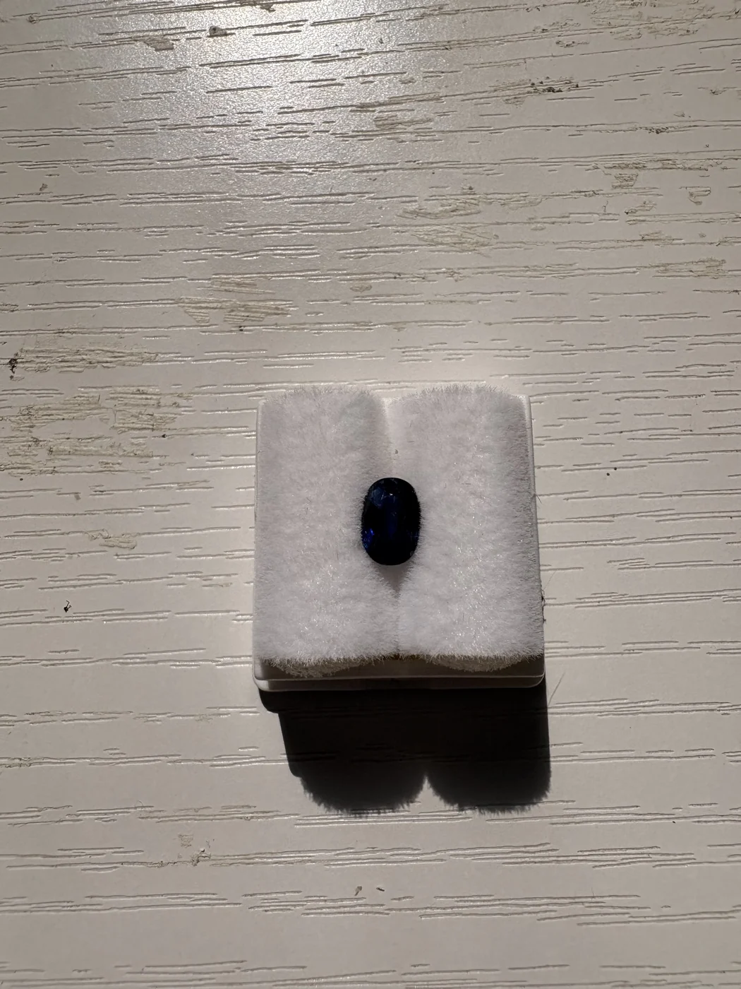Serial 108 oval blue sapphire in a display box
