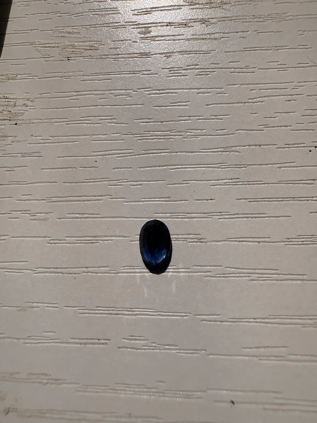 Serial 110 oval Sri Lankan blue sapphire under light