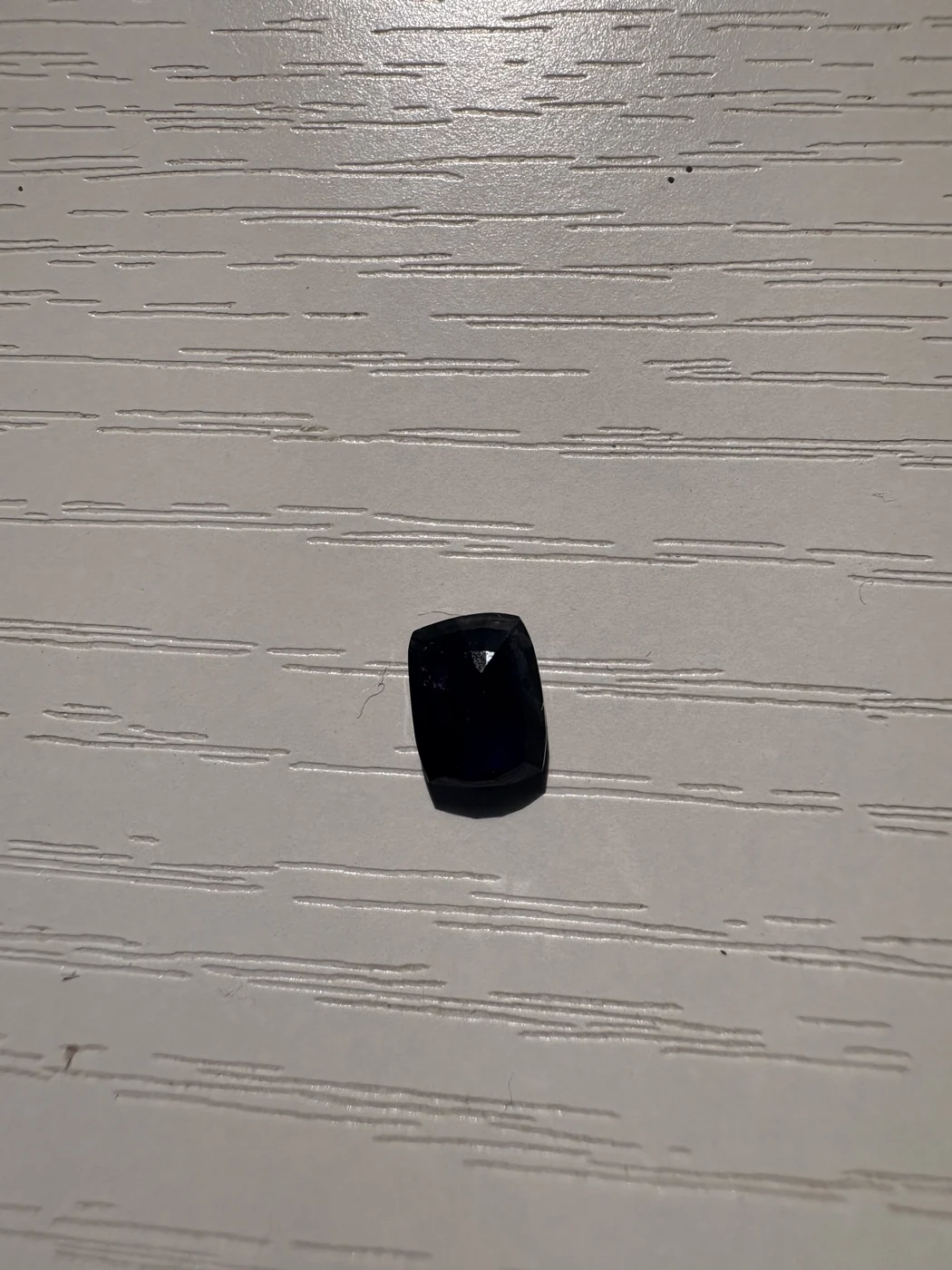 Serial 109 rectangular cushion Sri Lankan blue sapphire under light