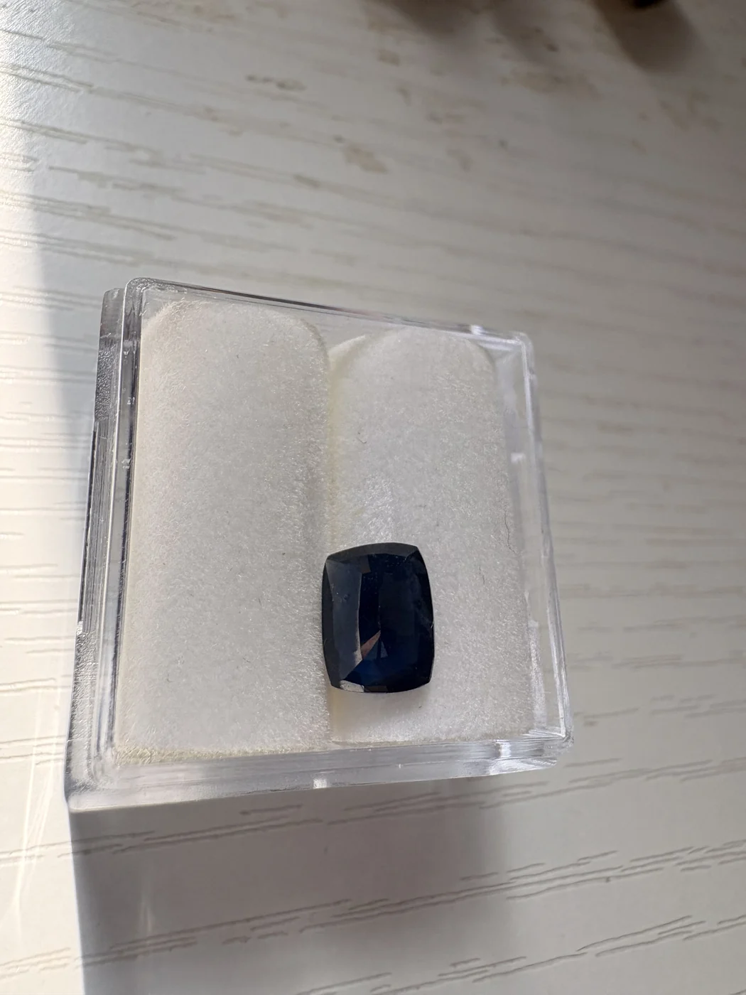 Serial 109 rectangular cushion blue sapphire in a display box